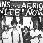 "Africans and Indians Unite Now" banner raised during the Black Power Movement March to Caroni